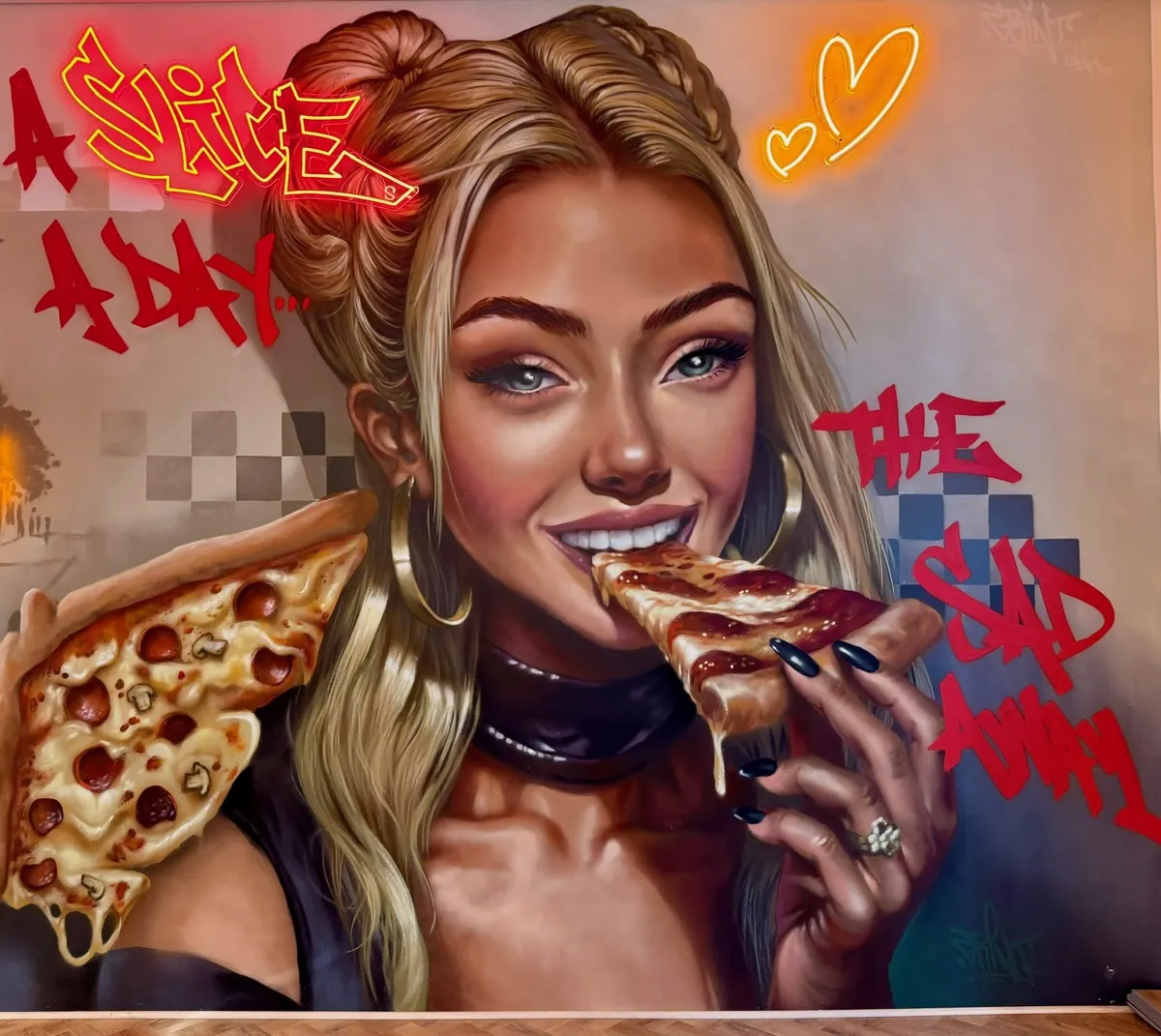 Maľba dievčaťa s pizzou na stene pizzerie